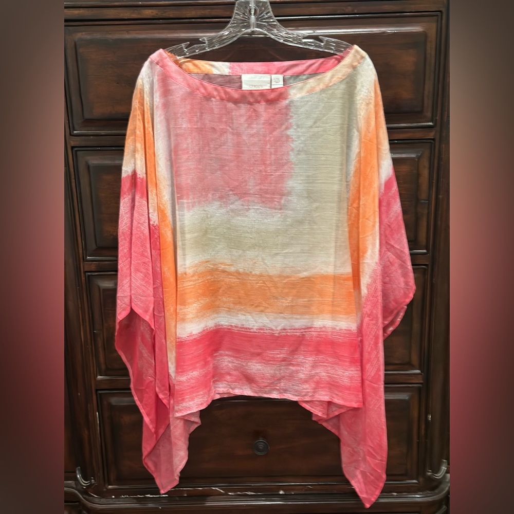 lightweight, blousy, throw over a tank and go. Pink, white and orange. L-XL